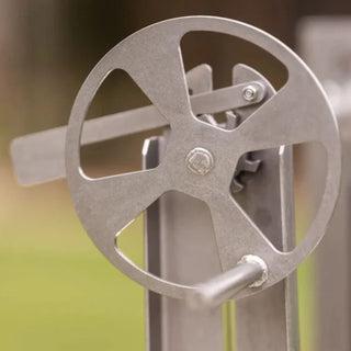 Metallic gate handle on a blurred background